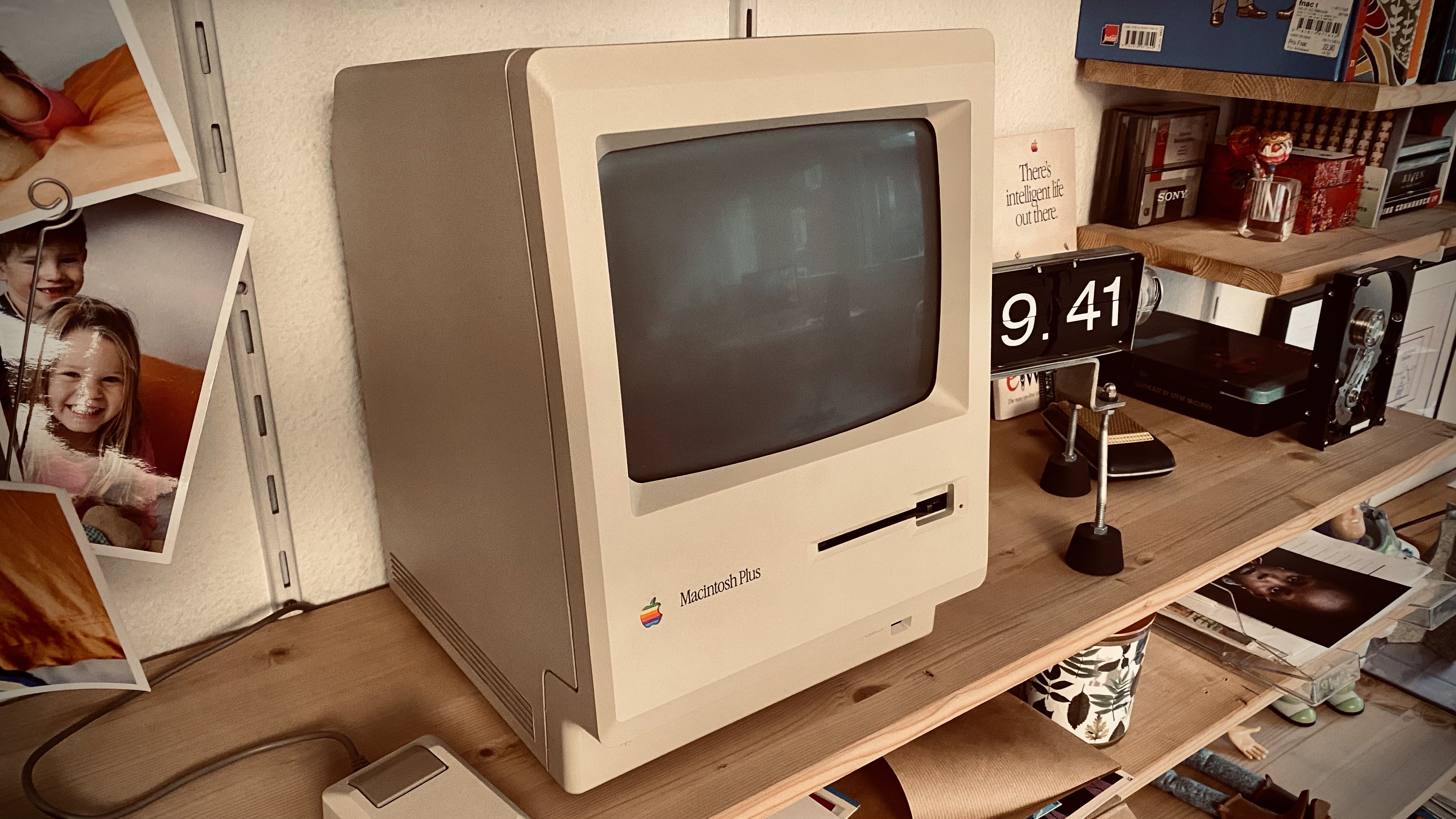 A smiling original Mac Plus 512