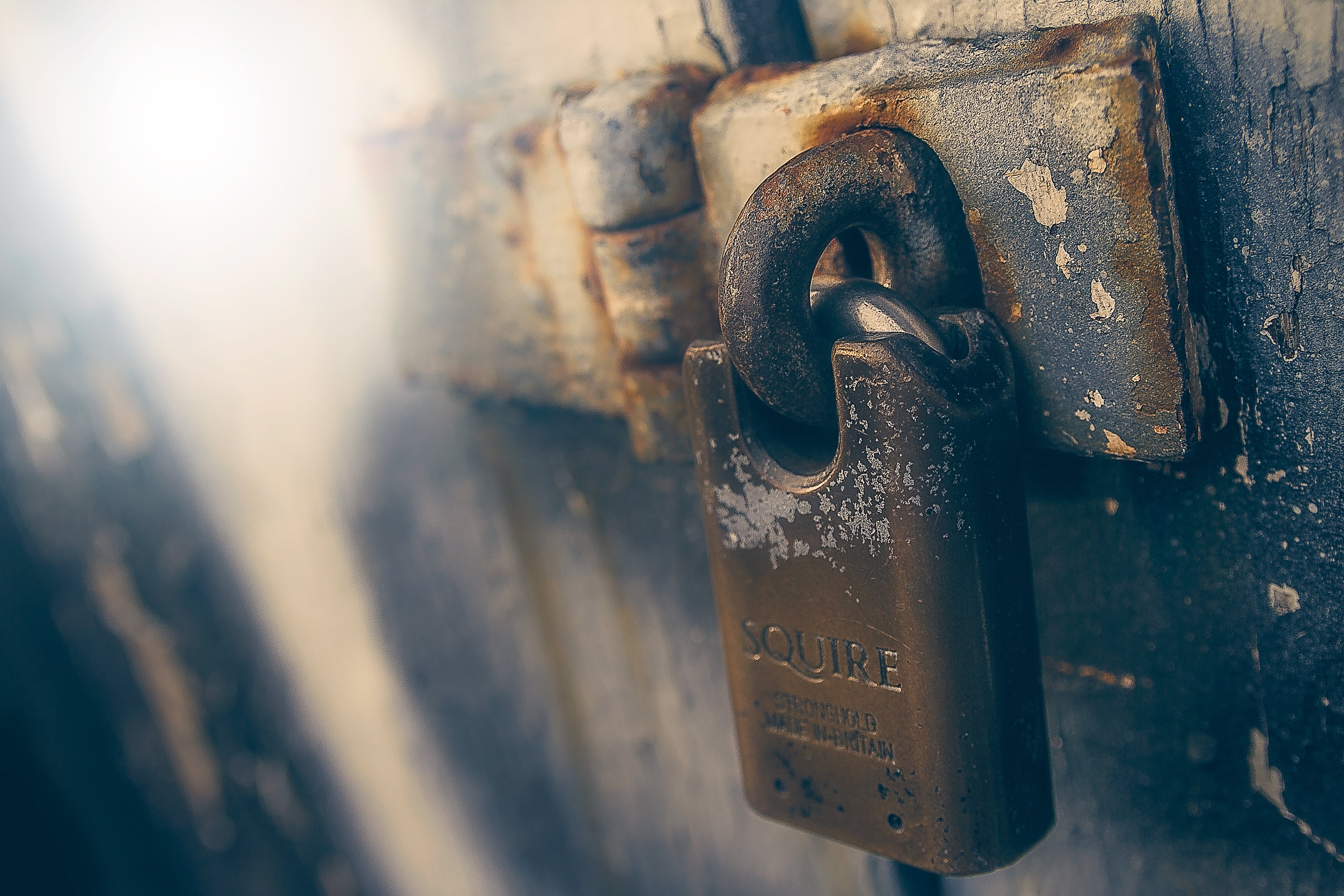 Photo of a rusted lock by James Sutton on Unsplash