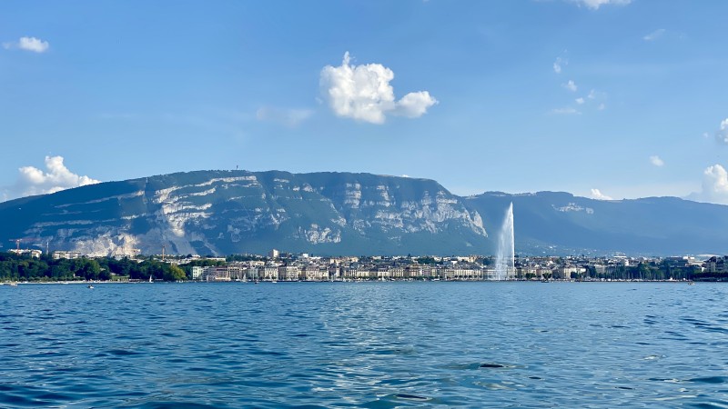 Geneva viewed froim the lake with the Salève in the background and the Jet d'Eau