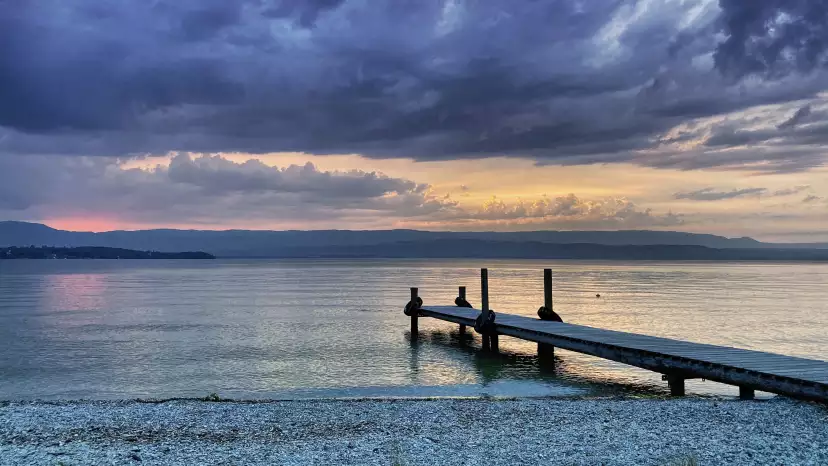 Pontoon under a heavy black sky