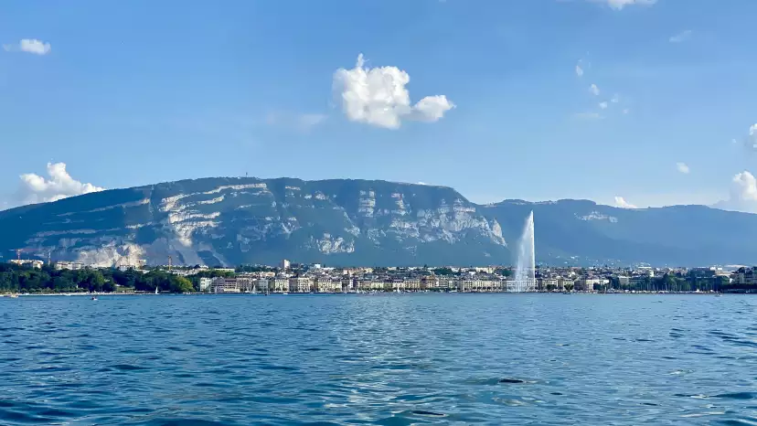 Geneva viewed froim the lake with the Salève in the background and the Jet d'Eau