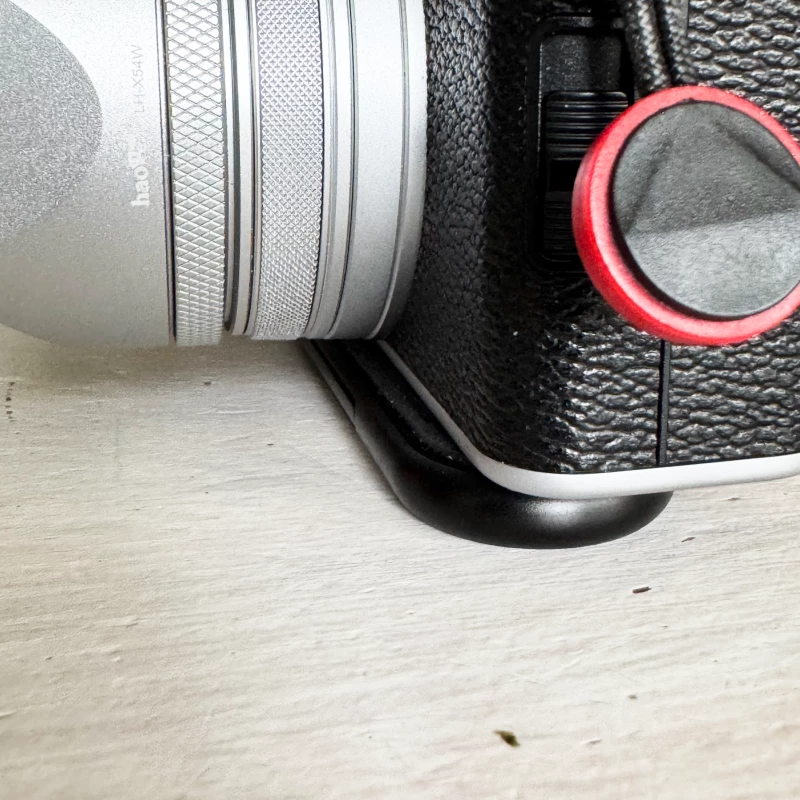 Fujifilm X100VI mounted with Peak Design's Micro Clutch overlapping in front
