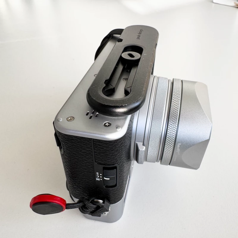 Fujifilm X100VI upside down mounted with Peak Design's Micro Clutch. It doesn't fit as well as on the X100V
