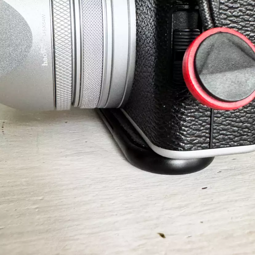 Fujifilm X100VI mounted with Peak Design's Micro Clutch overlapping in front