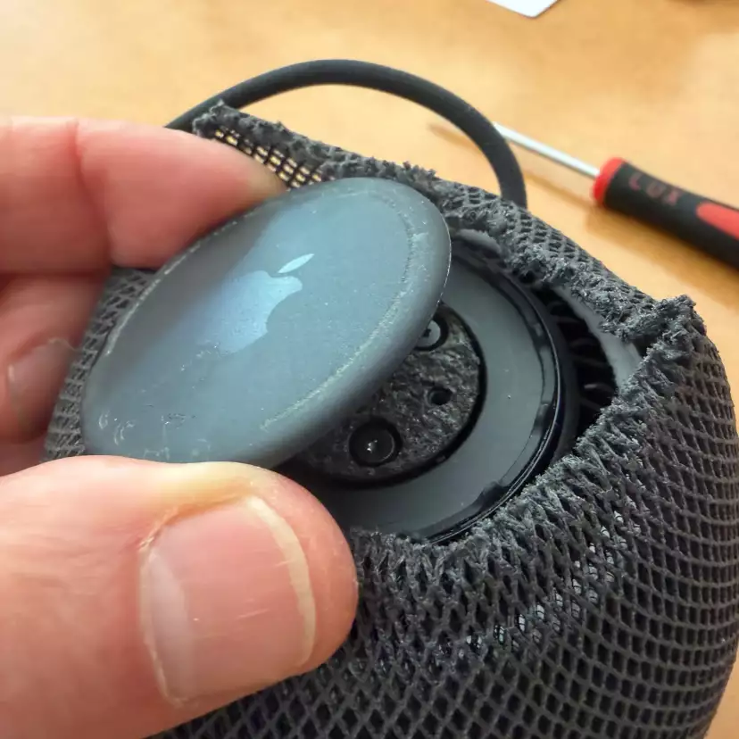 Use a prying tool to remove the HomePod mini base.