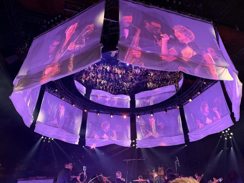 Purple lights on the screens and set for Purple Rain