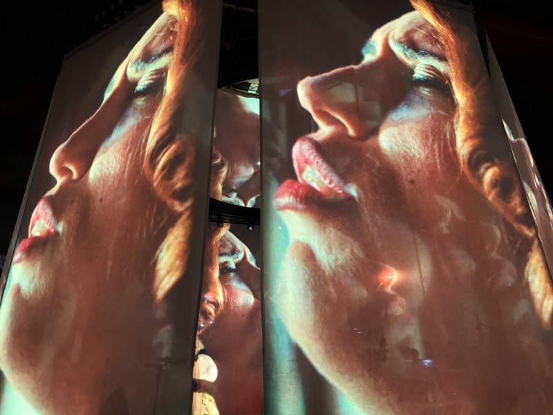 Projections of RAYE on the curtain screens seconds before the concert started