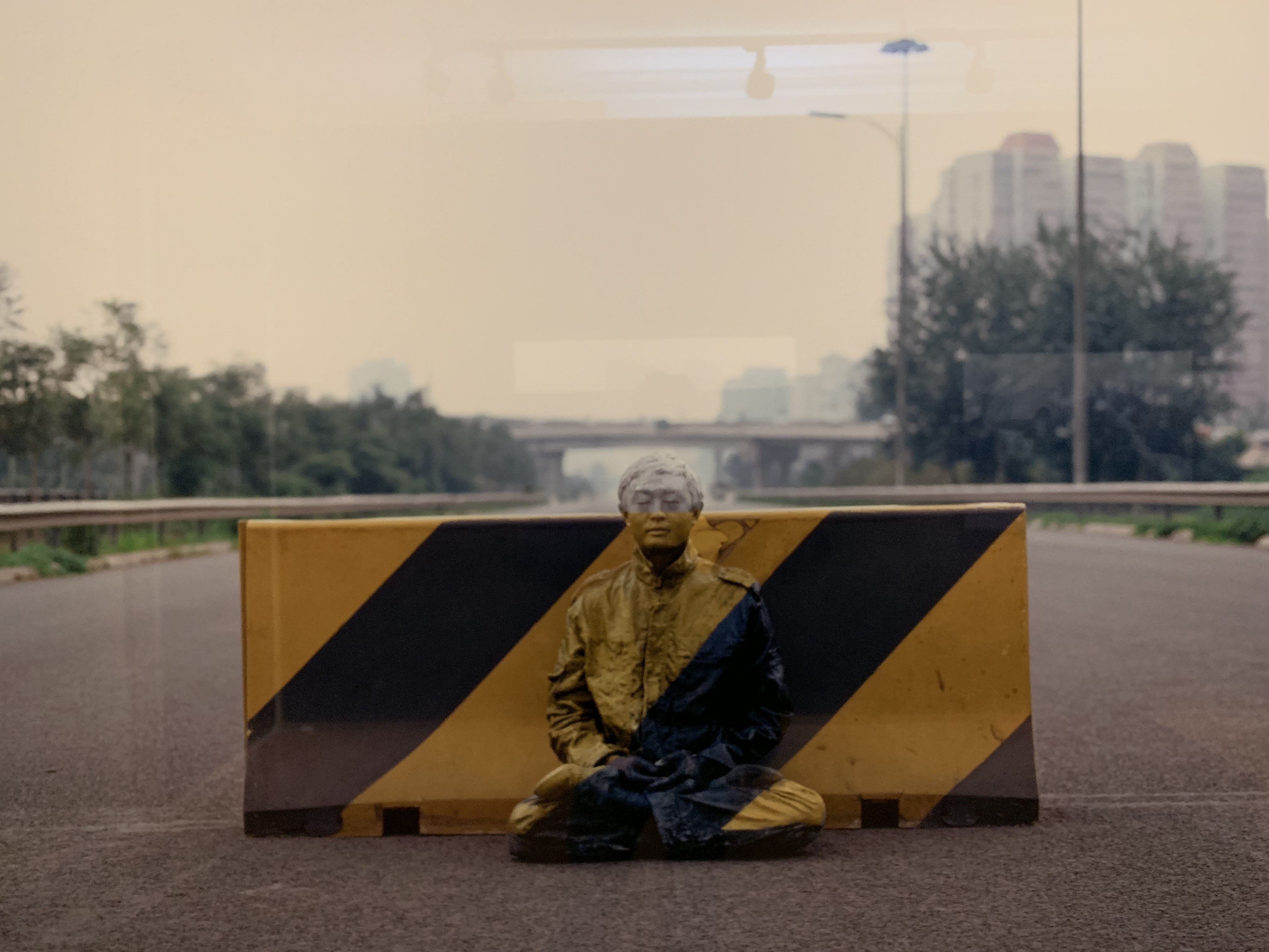 Liu Bolin painted into a road block