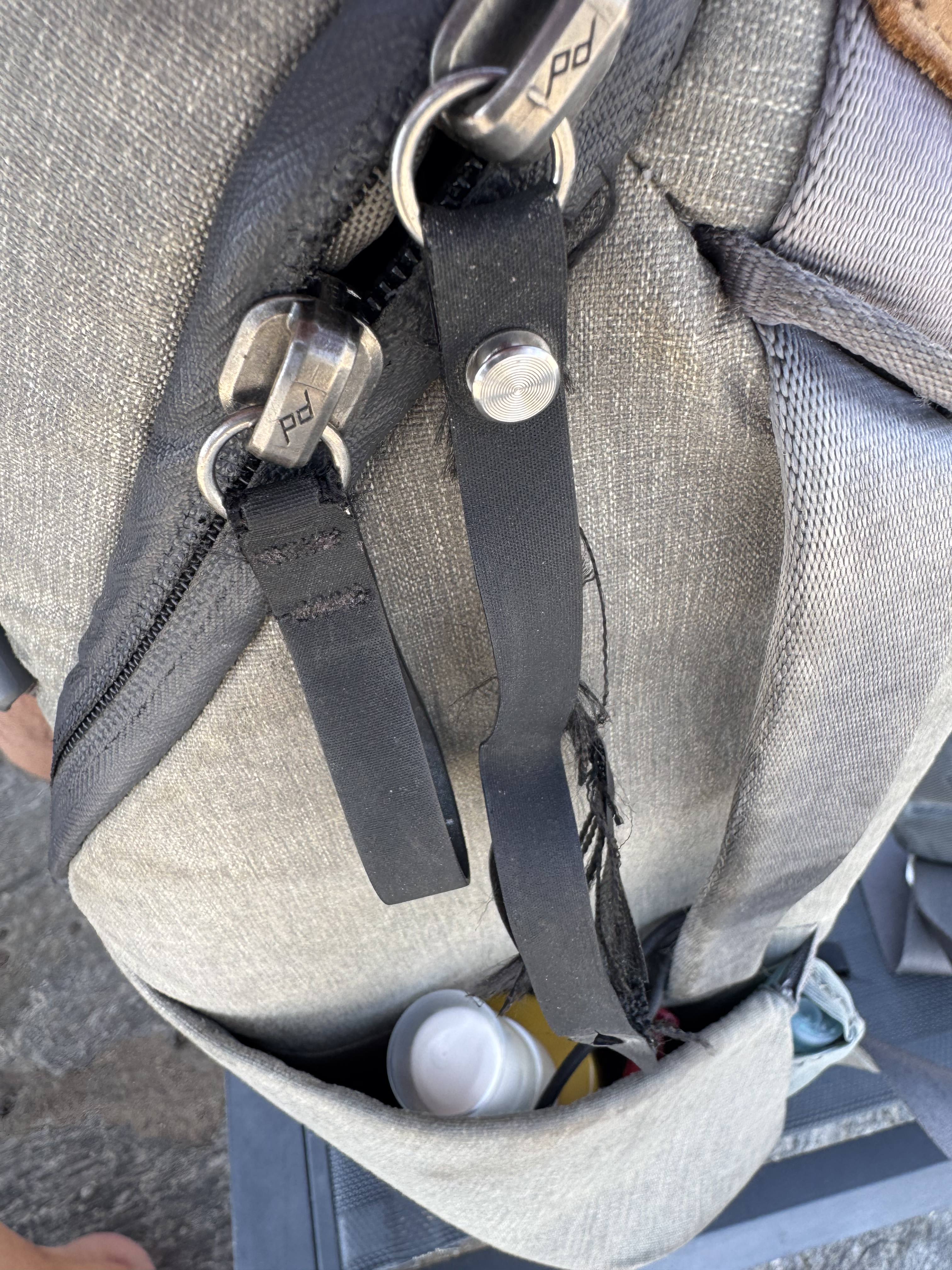 View of the front zip pulls - the fastening one is falling to bits