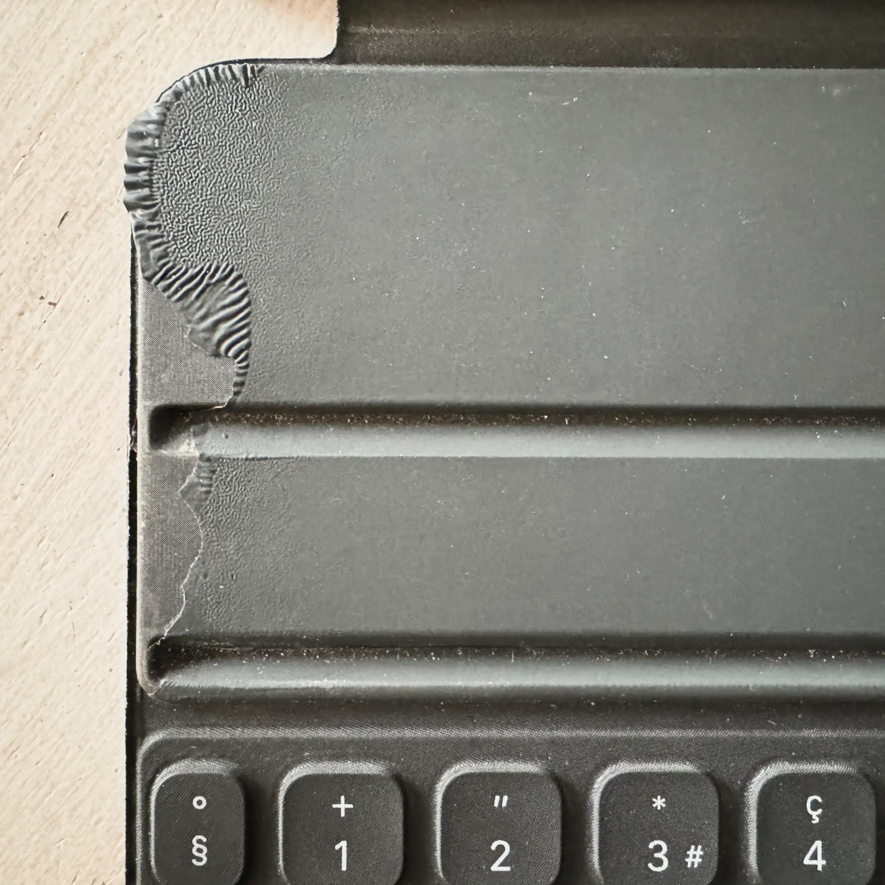 Top left inner corner of Smart Folio Keyboard peeling