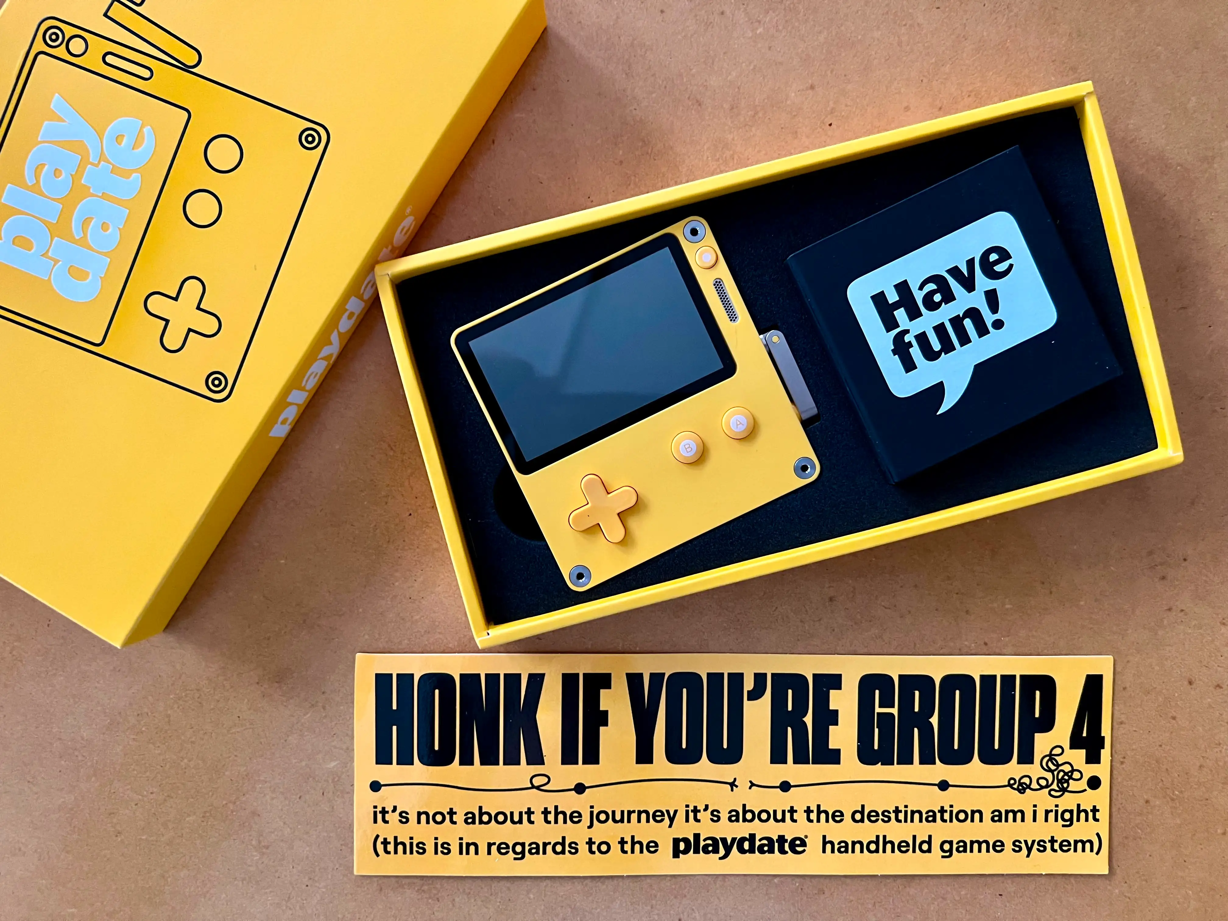 The Playdte in its yellow box with the bumper sticker “Honk if you are in Group 4“