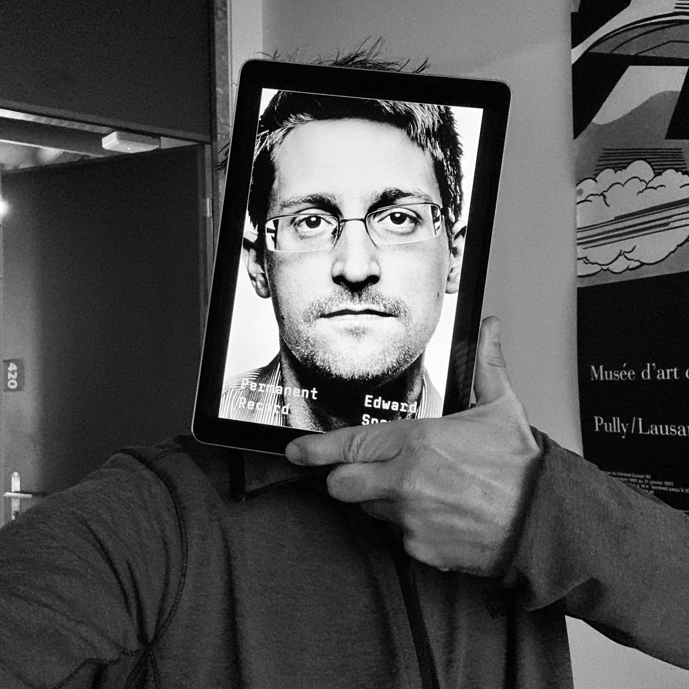 Self portrait with the portrait of Edward Snowden covering my face