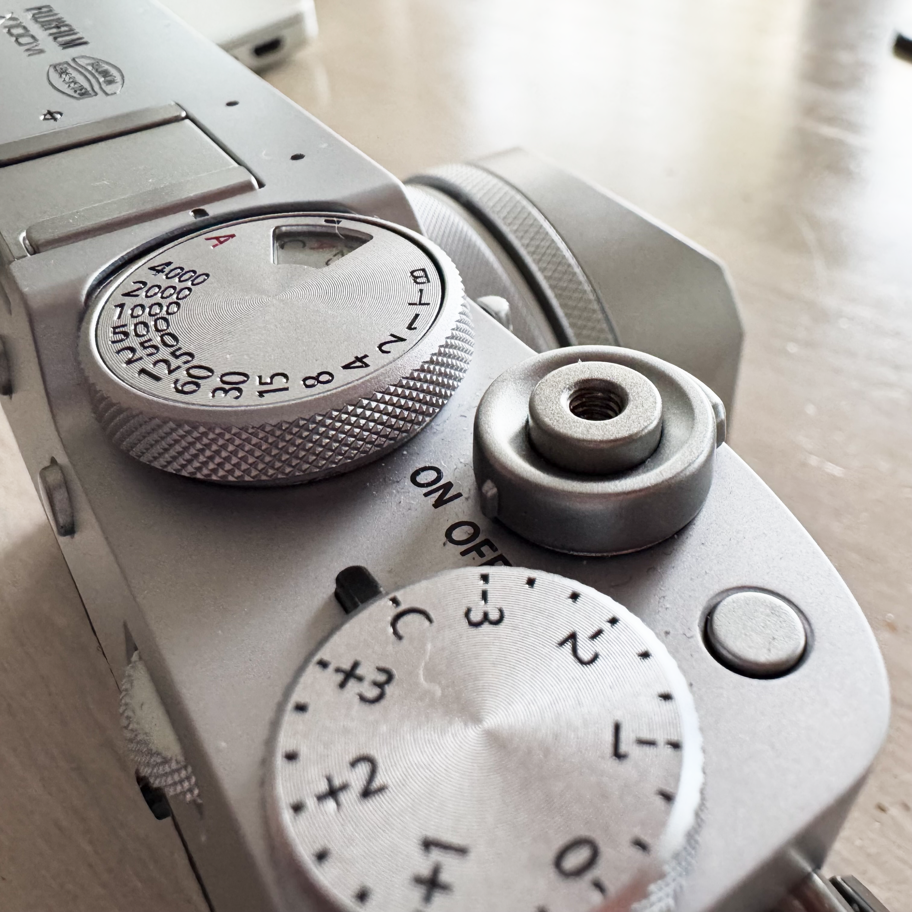 Close-up of the Fujifilm X100VI shutter button and exposition compensdation dial