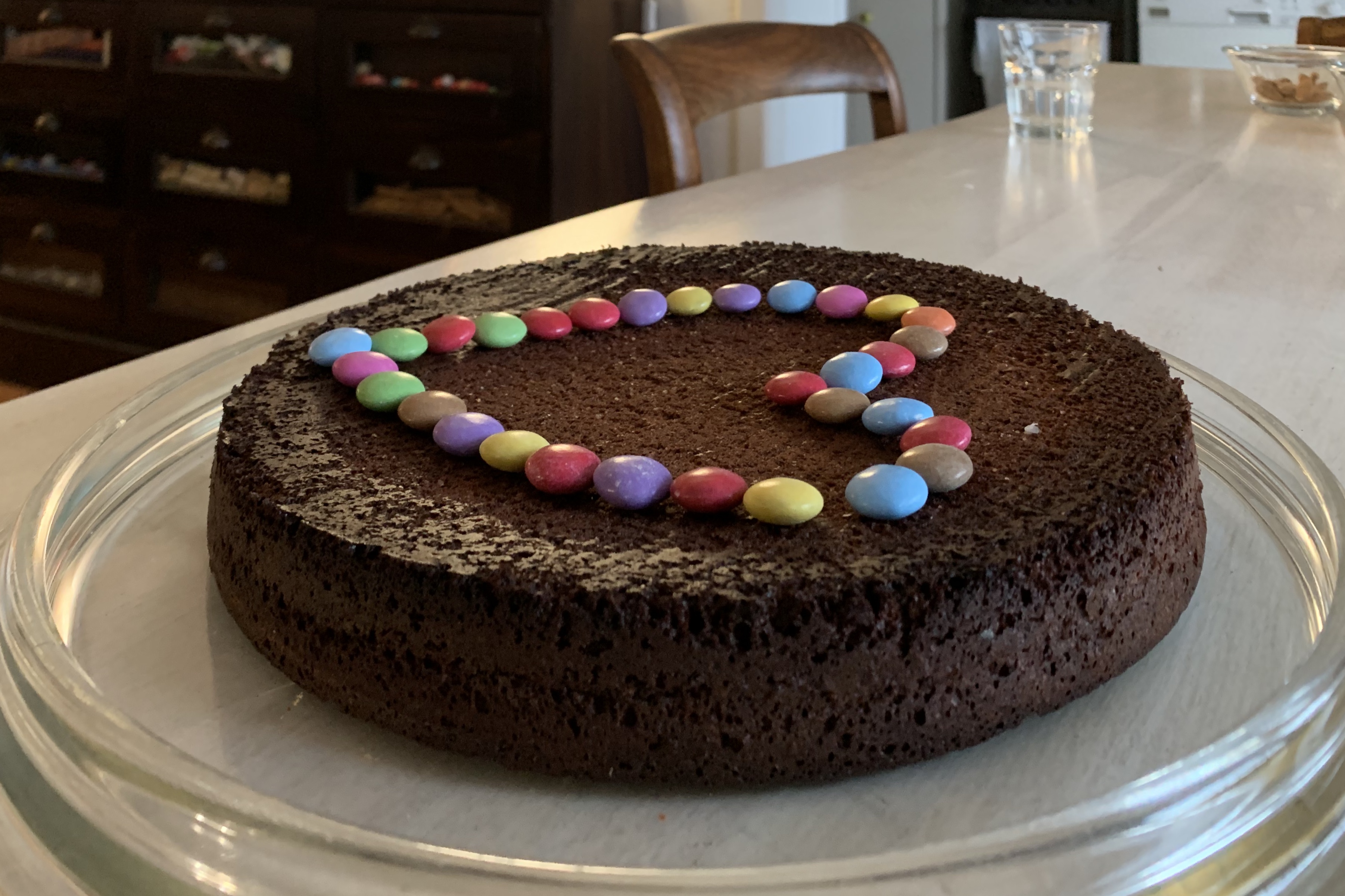 Chocolate cake with coloured smarties shaped as a heart