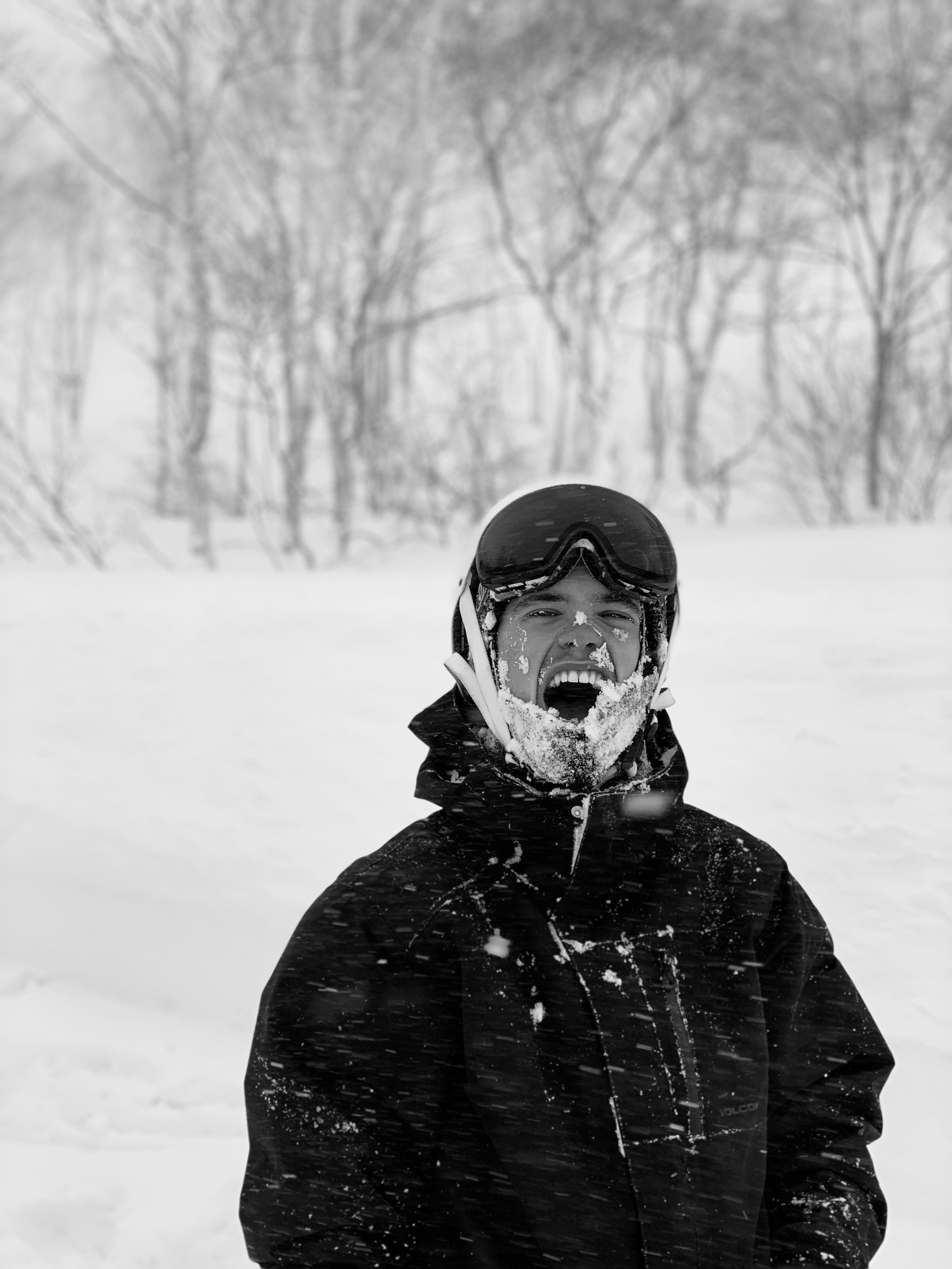Black and white portrait of Mathias covered in snow