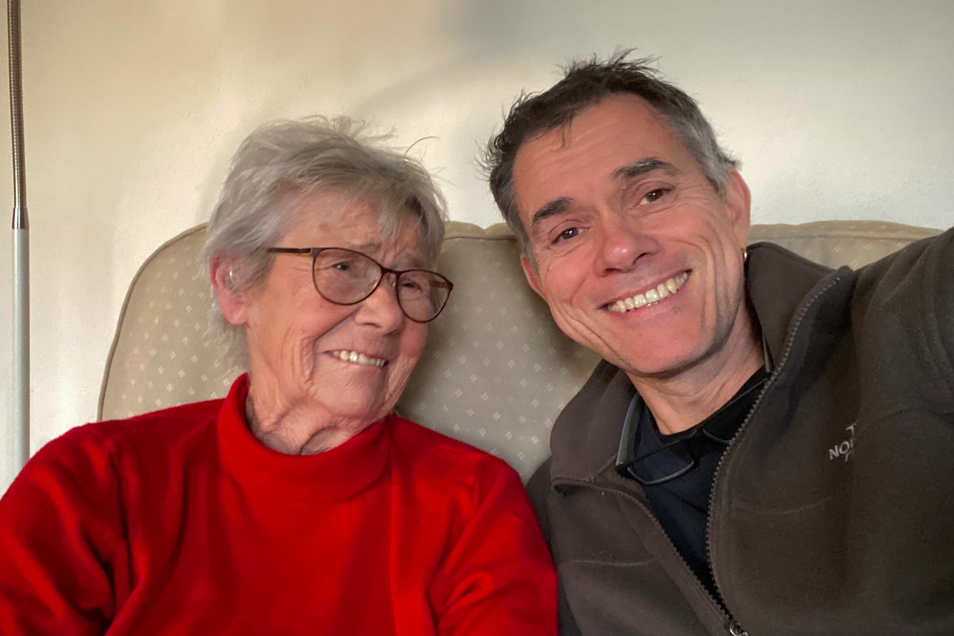 A selfie of Mum and myself sitting on her living room couch